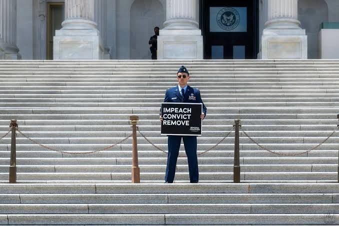 Air Force major arrested on Capitol steps during protest calling for Trump  impeachment