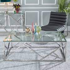 Stylish and sleek coffee table with glass top and a chrome colored metal base, this chic coffee table looks great with every kind of furniture, perfect for you afternoon coffee breaks while working. Urban Deco Maze Glass And Chrome Coffee Table
