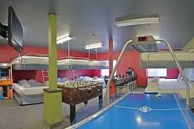 Located In Eau Claire Wi The Metropolis Resort Locker Room Accommodates Up To 20 Guests Comfortably With A Foos Ball T Hotels Room Eau Claire Indoor Waterpark