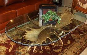 This is a coffee table made with four moose antlers. Moose Antler Coffee Table Sir Kodiak Montana Antler Works
