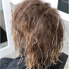 Bohemian teased bun for long hair. Read These 4 Tips Before Your Next Teasy Lights Appointment