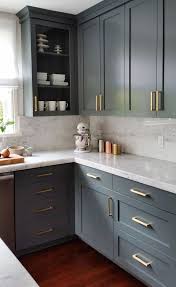To make the cabinets look more sparkling and stunning, tiny tiles are installed for the backsplash. 25 Ways To Style Grey Kitchen Cabinets