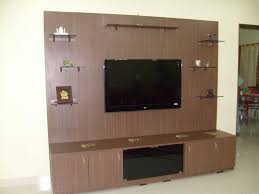 The shelves give a clear view of the items. Beautiful Dark Brown Wood Glass Modern Design Wall Unit Lcd Mount Under Storage Wall Glass Racks Wall Tv Unit Design Wall Unit Designs Interior Design Tv Wall