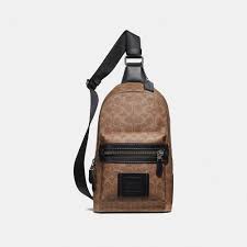Coach Academy Pack In Signature Canvas In Khaki Black Copper Modesens In 2020 Coach Crossbody Bag Purses Crossbody Canvas Sling Bag