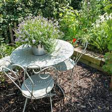 Consider training a climbing plant like roses up a garden arch for a stunning garden feature. Garden Seating Ideas For Your Outdoor Living Room