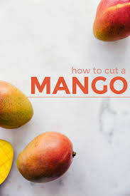 Then use a large spoon to scoop out the flesh and transfer it to a bowl to slice. How To Cut A Mango Step By Step Photos Chelsea S Messy Apron