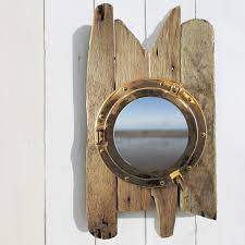 31.5'' h x 23.63'' w x 5.38'' d. Driftwood Porthole Cabinet Bathroom Cabinet Nautical Decor