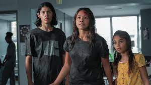 Jill, noah, and matilda encounter a group of nudists standing inexplicably in the middle of the road; Awake Review Eyes Wide Open The New York Times