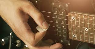 Once you have the correct angle of the pick on your first finger, the second step in how to hold a guitar pick is a cinch! How To Hold A Guitar Pick Correctly For Strumming Speed The Like Music Industry How To