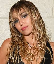 Miley cyrus cut her hair to raise money for cancer. Miley Cyrus Just Got The Edgiest Short Haircut Glamour