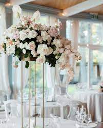 29 Tall Centerpieces That Will Take Your Reception Tables To New Heights Wedding Reception Centerpieces Wedding Flower Arrangements Tall Wedding Centerpieces