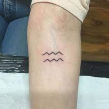 Flower constellation symbol arm tattoo idea. 38 Aquarius Zodiac Constellation Tattoos Horoscope Facts Aesthetic Ideas Aquarius Tattoo Constellation Tattoos Tattoos