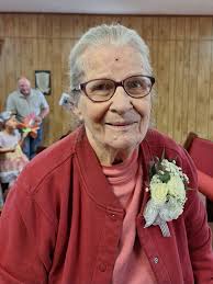 This is my mom can someone put pretty background. To make picture lighter  and pretty