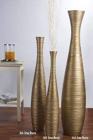 Large vases are lovely additions to bare corners, while vase sets allow you to create a cohesive theme throughout your home or a single coordinated display. Leewadee Tall Big Floor Standing Vase For Home Decor 44 Inches Mango Wood Golden Tall Floor Vases Floor Standing Vase Tall Vase Decor