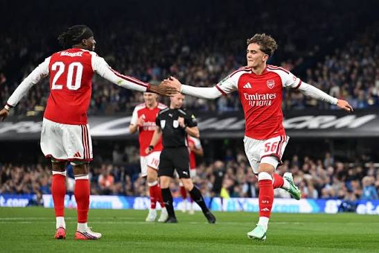 Arsenal players in action during a Premier League fixture