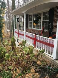 Use Decorative Mesh And Plaid Ribbon To Make Your Front Porch Railing Look Like A Wrapped Present Christmas Porch Front Porch Railings Exterior Decor