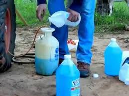 Filling A Tractor Tire Up With Winshield Washer Fluid For Weight