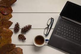 Premium Photo | Top view of office desk workspace with cup of tea and  laptop on white table background flat lay