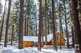 Two of the bedrooms and a fully stocked kitchen are also located on the top floor. 9 Cozy South Lake Tahoe Cabins To Rent For Your Ski Trip