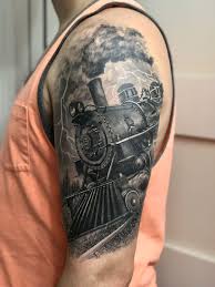 Discover masculine railroad designs with realistic smokestacks and steam. Train Tattoo Train Tattoo Steam Train Tattoo Tattoos