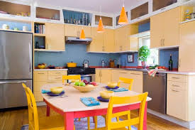 Yellow birch cabinets with a distressed finish make a colorful statement against walls of white subway tile. 50 Yellow Kitchen Ideas Photos Home Stratosphere