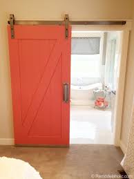Sliding barn doors are a great way of making utilitarian spaces feel more inviting. Remodelaholic 35 Diy Barn Doors Rolling Door Hardware Ideas