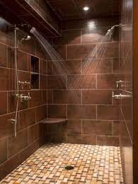 Dark brown floor tiling adds contrast with white walls and glass shower enclosure. 29 Brown Beige Tile Shower Ideas Bathroom Design Bathrooms Remodel Shower Tile