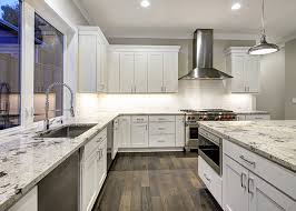 The cabinets are painted a very pale gray that looks white in certain light. Complete Kitchen And Bath Design Studio Charlotte Nc