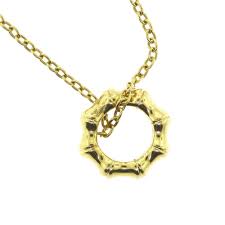 Gucci 18k Yellow Gold Bamboo Collection Circle Ring Pendant The most common gucci logo gold material is metal. gucci 18k yellow gold bamboo collection circle ring pendant