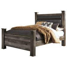 A refined take on rustic board beauty, its complex, replicated wood grain showcases a sense of weatherworn. Signature Design By Ashley Wynnlow Queen Rustic Poster Bed With Upholstered Headboard Royal Furniture Upholstered Beds