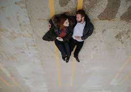 Even if they don't see each other every day anymore, the real people who inspired the upside seem to have bonded. Woman Man Laying Road Couple Redhead Upside Down Full Length Piqsels