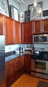 Using Art Work To Balance Out Those High Ceilings Above The Cab Decorating Above Kitchen Cabinets Above Kitchen Cabinets How To Decorate Above Kitchen Cabinets