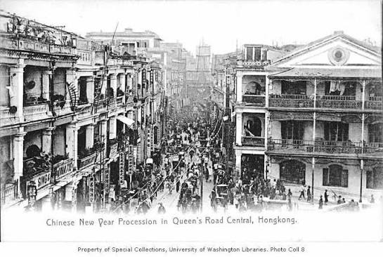 Chinese New Year parade on Queen's Road Central with carriages, rickshaws, and pedestrians, Hong Kong, ca. 1910 - International Collections - University of Washington Digital Collections