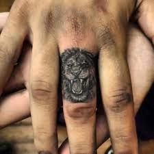 Fierce Lion Finger Knuckle Tattoo Lion Tattoo On Finger Lion Tattoo Finger Tattoos