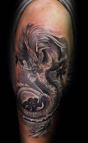 Man With White And Grey Ink Flying 3d Dragon Arm Tattoo 3d Dragon Tattoo Dragon Tattoo Designs Dragon Tattoo