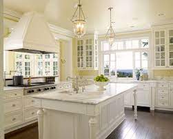 I just love these gorgeous kitchen cabinet colors! Yellow Walls And White Cabinets Yellow Kitchen Walls White Kitchen Traditional Yellow Kitchen