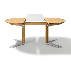 So some guests will be sitting around the coffee table expandable dining tables come in a variety of sizes and styles, many with internal hidden round tables are perfect for corners and other tight spaces. Luxury Round Dining Tables Team 7 Girado Wharfside Dining Furniture