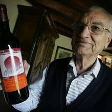 Serge C. Renaud with a bottle of wine. Serge C. Renaud became an...