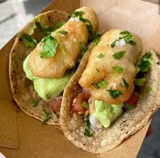 The spicy, chunky salsa spooned on top is delicious enough to eat on its own as a salad. Baja Fish Taco With Guacamole And Chunky Salsa Picture Of Reys Tacos By Rey Del Cerdo Manchester Tripadvisor