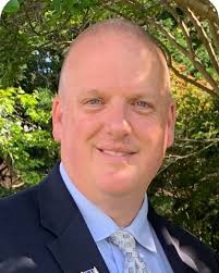 The Board appointed Mr. Michael Watson as Chief Operating Officer in the  Division of Supporting Services. Mr. Watson holds a Master's from the  College of Notre Dame of Maryland and a Bachelor's