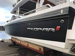 Axopar 37 Turned Carbon Today With Another Hull Wrapdespite The Rain Boat Wraps Boat Brands Boat