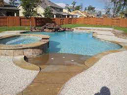 Gunite Swimming Pool With Raised Spa Beach Entry Moss Rock Waterfall And Flagstone Coping Beach Entrance Pool Fiberglass Pools Beach Entry Pool