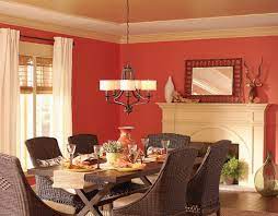 This dining room showcases a wooden dining table paired with gray chairs that sit on a green floral rug. 5 Recommended Colors To Paint The Walls Of The Dining Room Creative Home