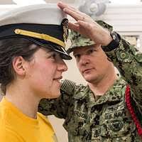 US Navy MASTER at Arms First Class Joe Concepcion mans the rail while his  ship, USS REUBEN JAMES (FFG 57) pulls alongside the Chilean flagship BLANCO  ENCALADA (DLH 15) in the port