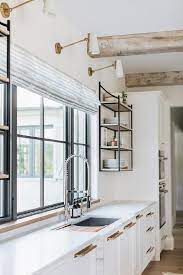 More light is always welcome in the kitchen, especially over the countertop work areas. Kitchen Sink With Sliding Cutting Board Transitional Kitchen