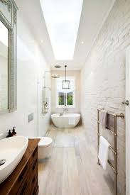 A floating vanity helps add more visual space. Narrow Bathroom Inspirational Best 25 Long Narrow Bathroom Ideas On Pinterest Sabzandish Bathroom Design Layout Narrow Bathroom Designs Small Bathroom Layout