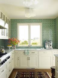 white kitchen with green mosaic tile