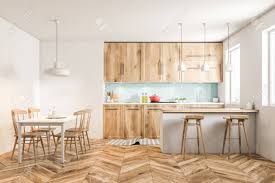 Scandinavian kitchens are usually associated with clean lines, whites and light woods together with natural materials as a foundation. White Scandinavian Style Kitchen Interior With Blue Tiled And Stock Photo Picture And Royalty Free Image Image 103382854