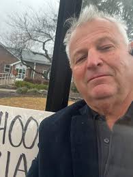 2024 10 am Thanksgiving Day here for Street School reunion. Maybe it's  raining but there's a bus shelter with bench. Let's get the party started! 