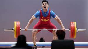 Snatch and clean and jerk. China S Weightlifting Champion Shi Ready For Olympic Gold In Tokyo Cgtn